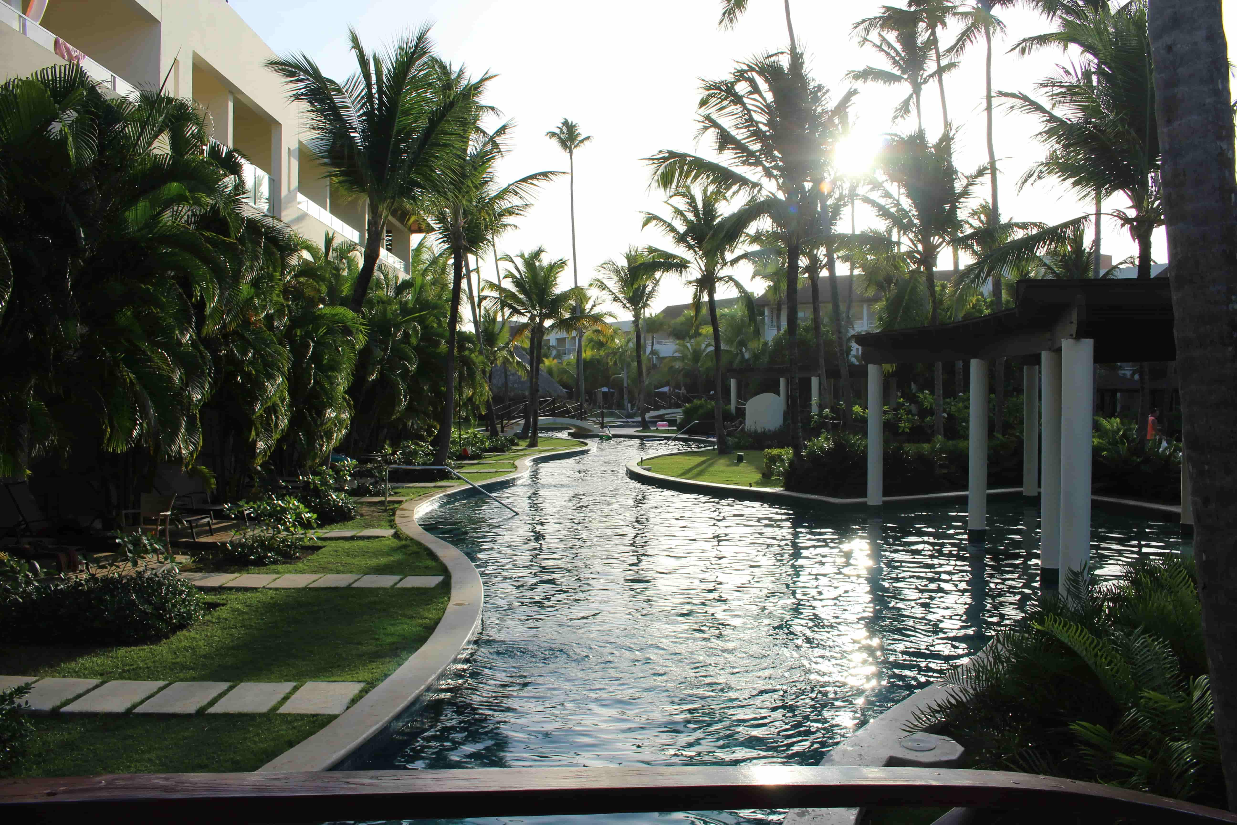 Luxury beachfront residential development in the Dominican Republic featuring tropical landscaping, a lagoon-style pool and premium waterfront apartments.