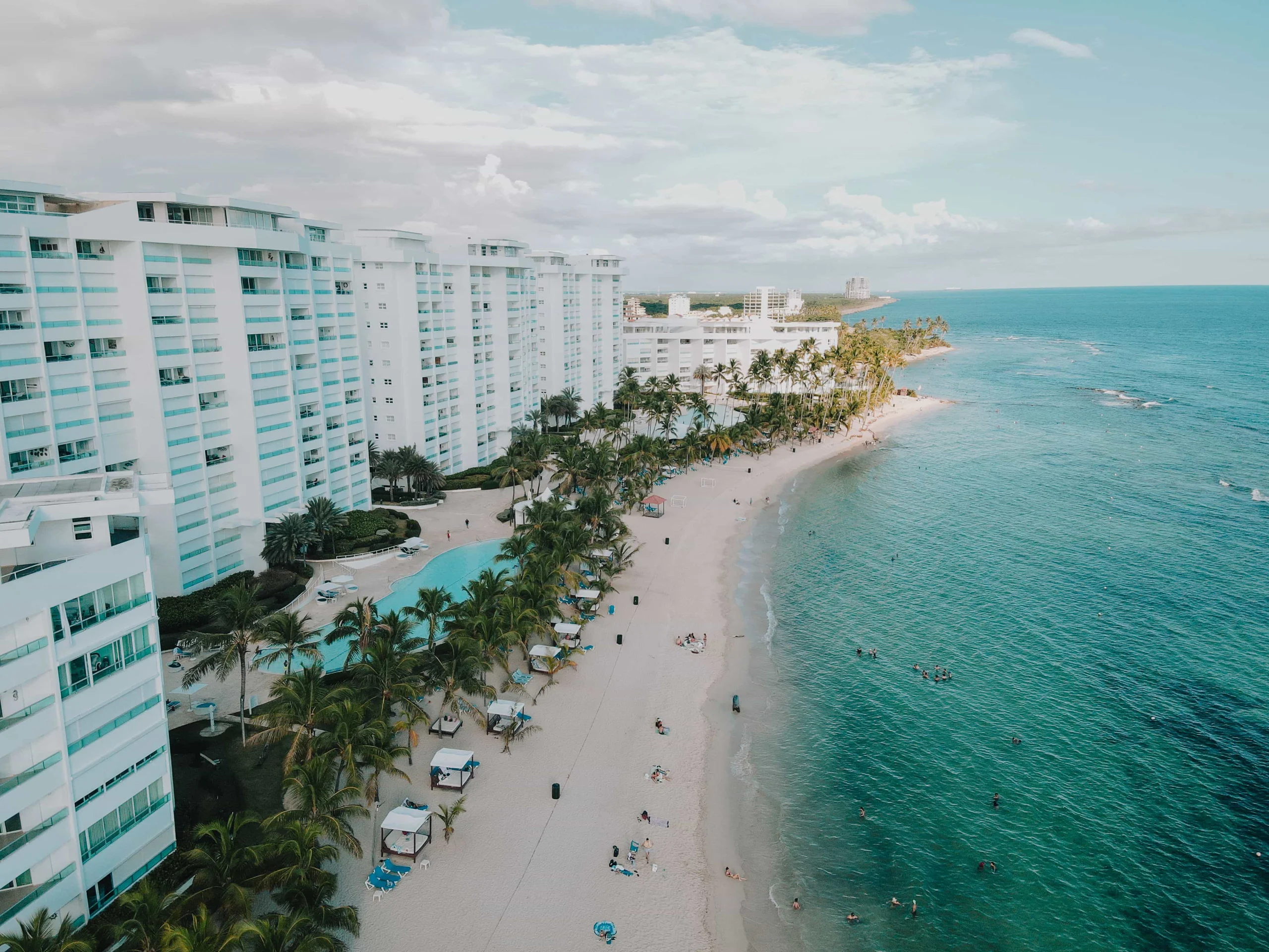 A stunning aerial view of luxury beachfront resorts in Juan Dolio, Dominican Republic.